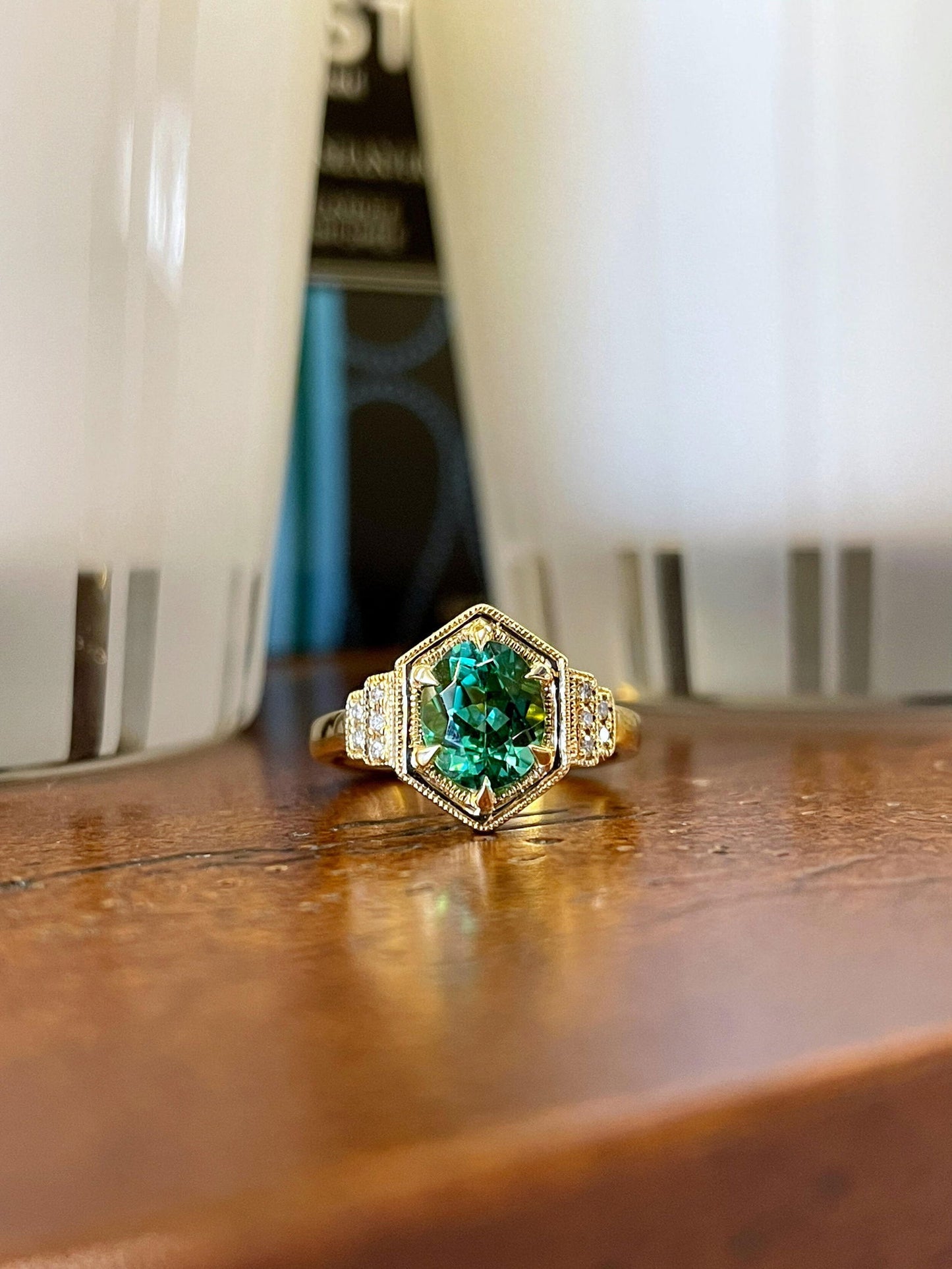Photo of Tourmaline and Diamond Ring in a decorative scene, designed by , available at Plumb Gold & Plumb Silver