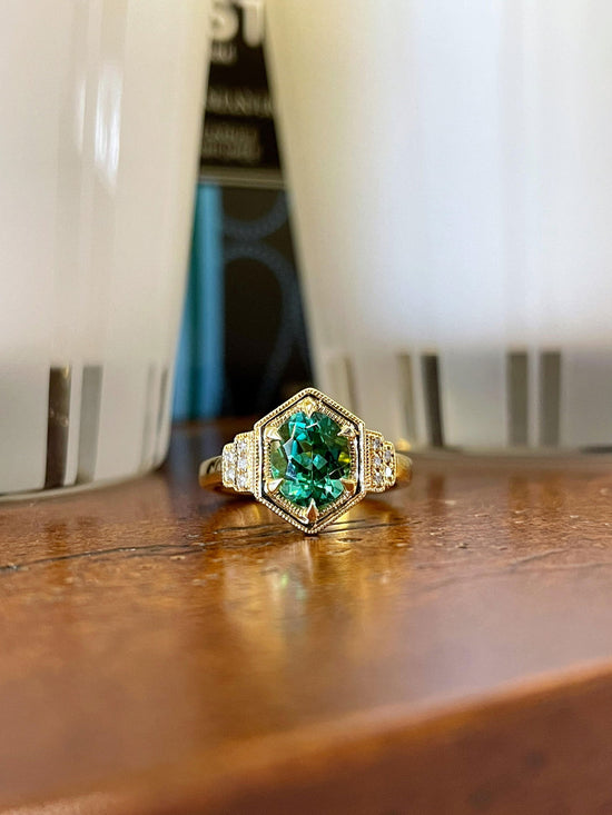 Photo of Tourmaline and Diamond Ring in a decorative scene, designed by , available at Plumb Gold & Plumb Silver