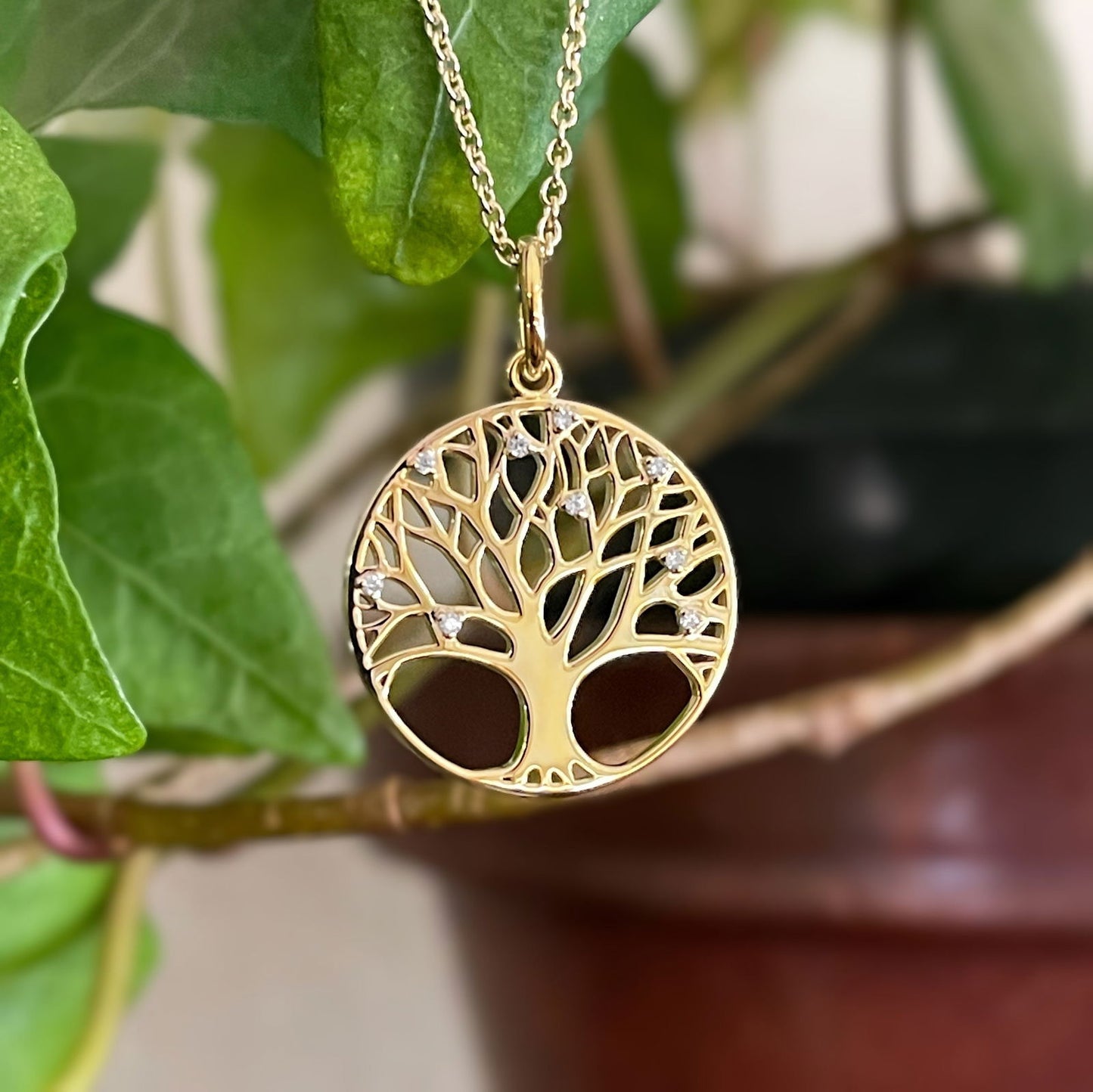 Photo of Tree of Diamonds Necklace in a decorative scene, designed by , available at Plumb Gold & Plumb Silver