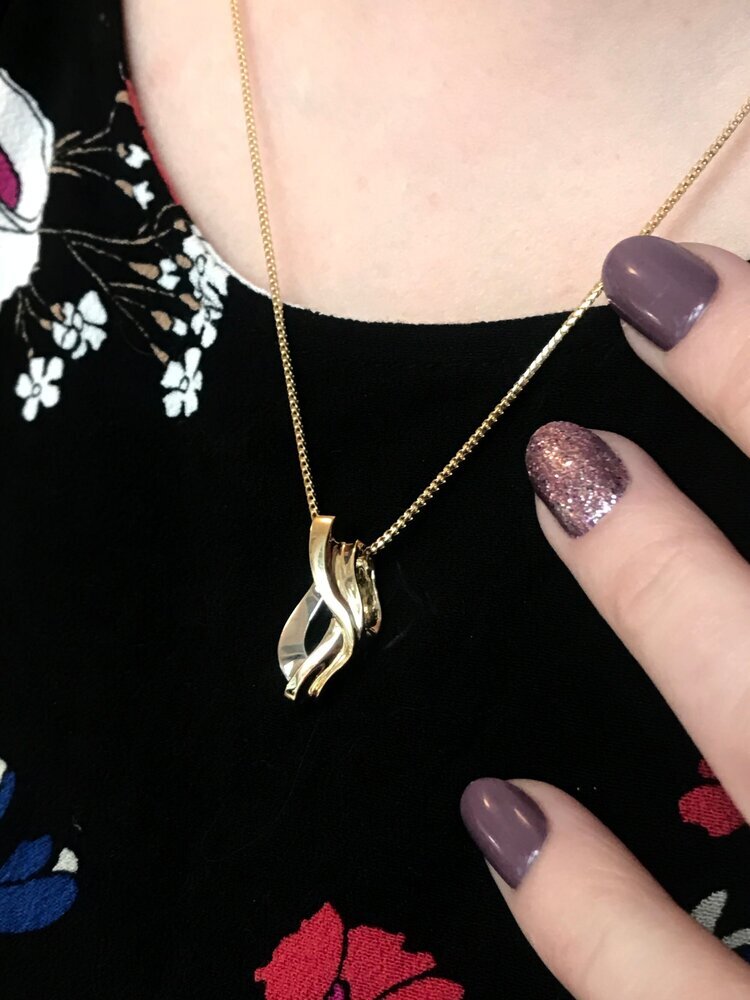 Photo of Twist Slide in a decorative scene, designed by , available at Plumb Gold & Plumb Silver