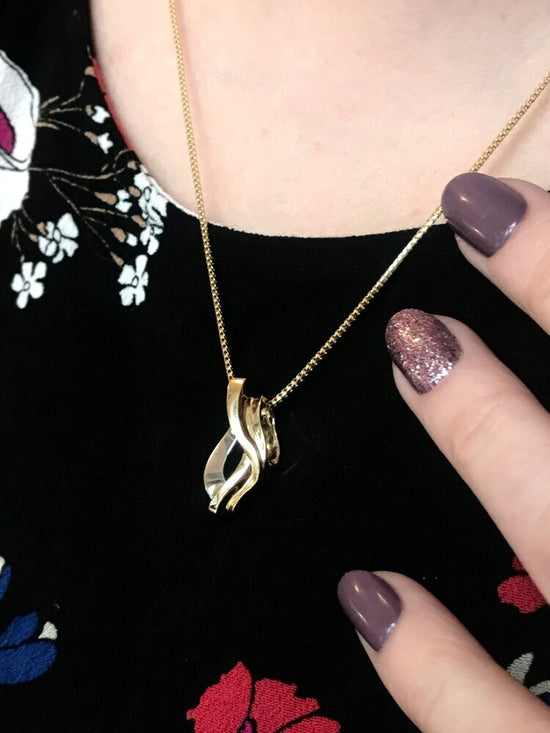 Photo of Twist Slide in a decorative scene, designed by , available at Plumb Gold & Plumb Silver
