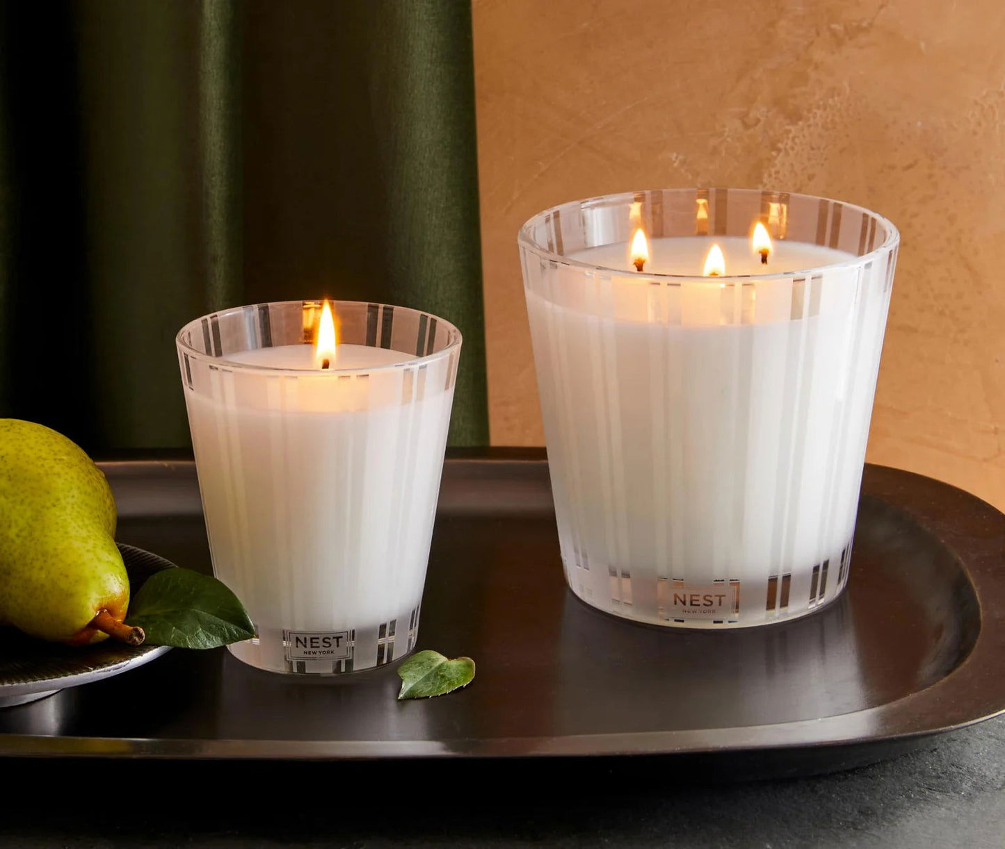 Photo of Velvet Pear Candle in a decorative scene, designed by , available at Plumb Gold & Plumb Silver