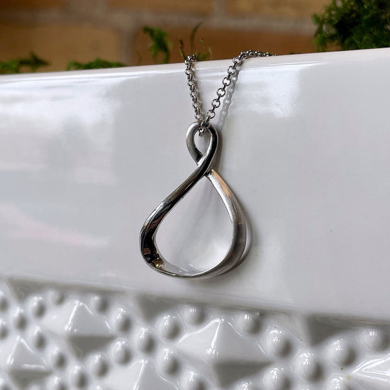 Photo of “Venice” Twist Pendant in a decorative scene, designed by , available at Plumb Gold & Plumb Silver