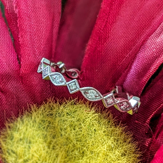 Photo of "Vera" Art Deco Band in a decorative scene, designed by , available at Plumb Gold & Plumb Silver