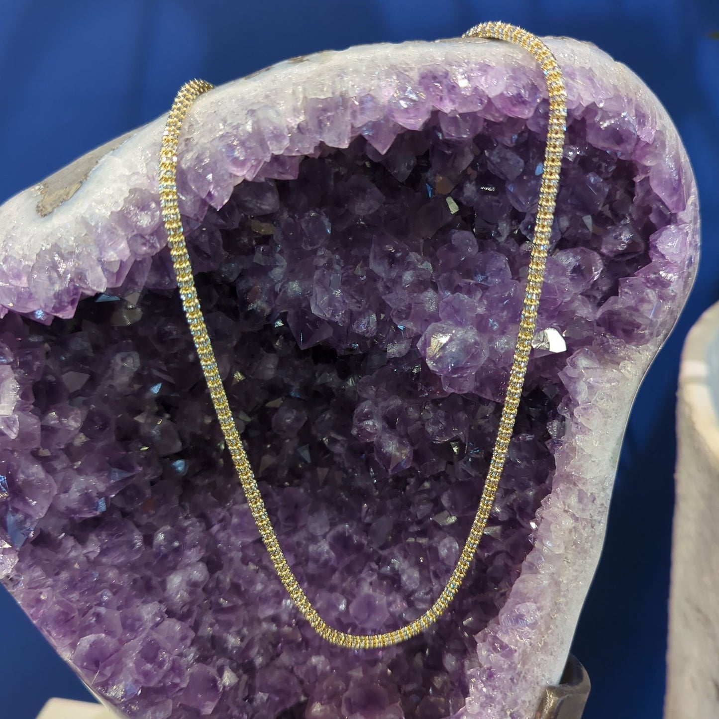 Photo of Vergano "Ice" Link Necklace in a decorative scene, designed by , available at Plumb Gold & Plumb Silver