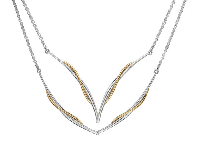 Photo of "Vineyard Swing" Necklace in a decorative scene, designed by , available at Plumb Gold & Plumb Silver