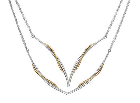 Photo of "Vineyard Swing" Necklace in a decorative scene, designed by , available at Plumb Gold & Plumb Silver