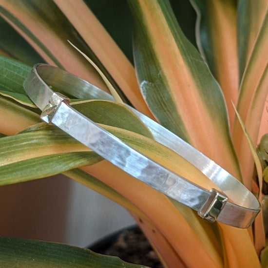 Photo of "Waltz" Bracelet in a decorative scene, designed by , available at Plumb Gold & Plumb Silver