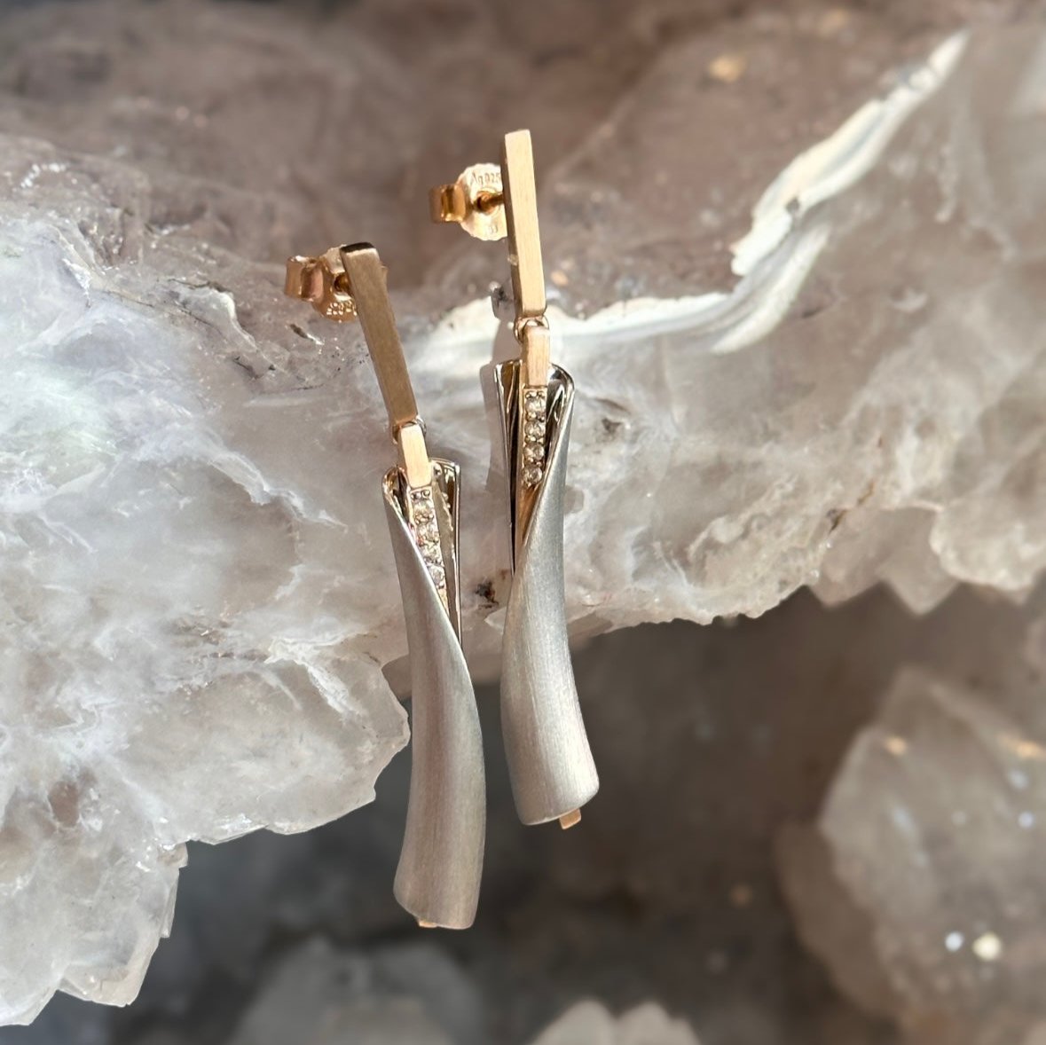 Photo of Wrap Dangles in a decorative scene, designed by , available at Plumb Gold & Plumb Silver