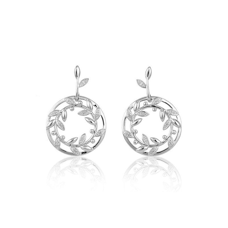 Photo of Wreath Earrings in a decorative scene, designed by , available at Plumb Gold & Plumb Silver