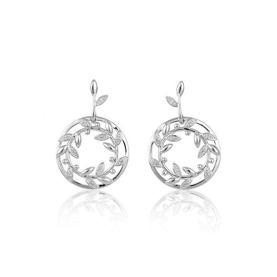 Photo of Wreath Earrings in a decorative scene, designed by , available at Plumb Gold & Plumb Silver