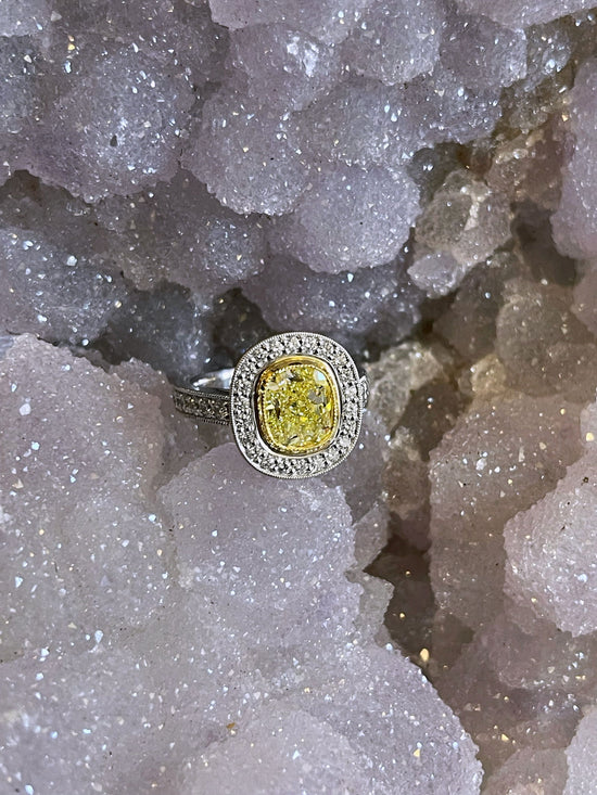 Photo of Yellow Diamond Ring in a decorative scene, designed by , available at Plumb Gold & Plumb Silver
