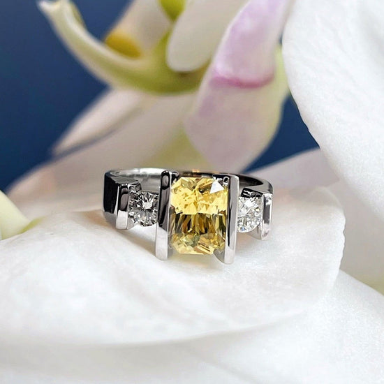 Photo of Yellow Sapphire and Diamond Ring in a decorative scene, designed by , available at Plumb Gold & Plumb Silver