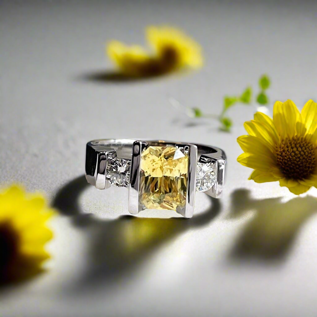 Photo of Yellow Sapphire and Diamond Ring in a decorative scene, designed by , available at Plumb Gold & Plumb Silver