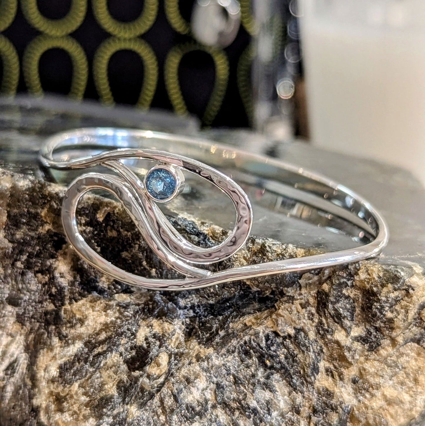 Photo of "Yin Yang" Bracelet in a decorative scene, designed by , available at Plumb Gold & Plumb Silver