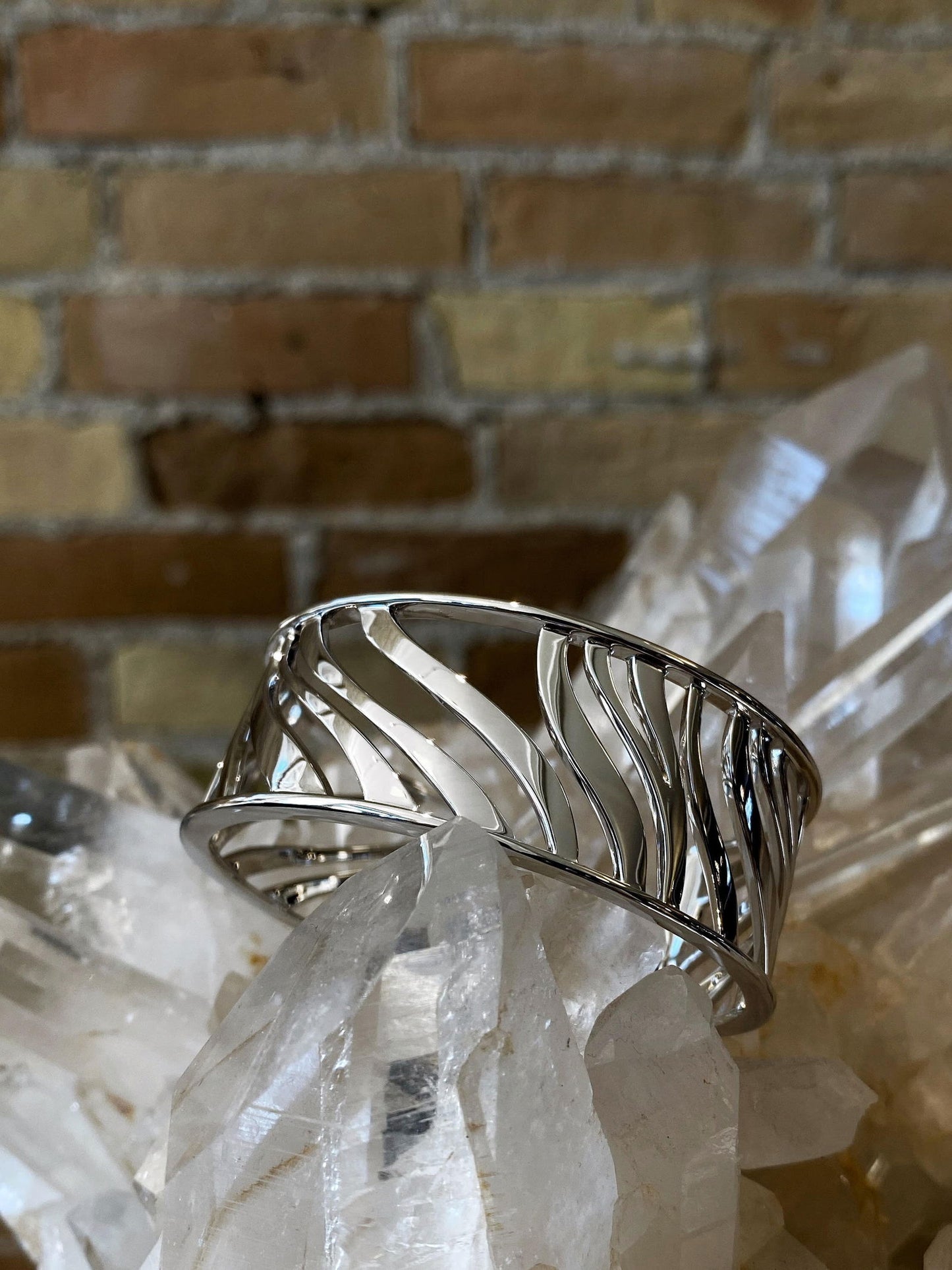 Photo of Zebra Stripe Cuff in a decorative scene, designed by , available at Plumb Gold & Plumb Silver