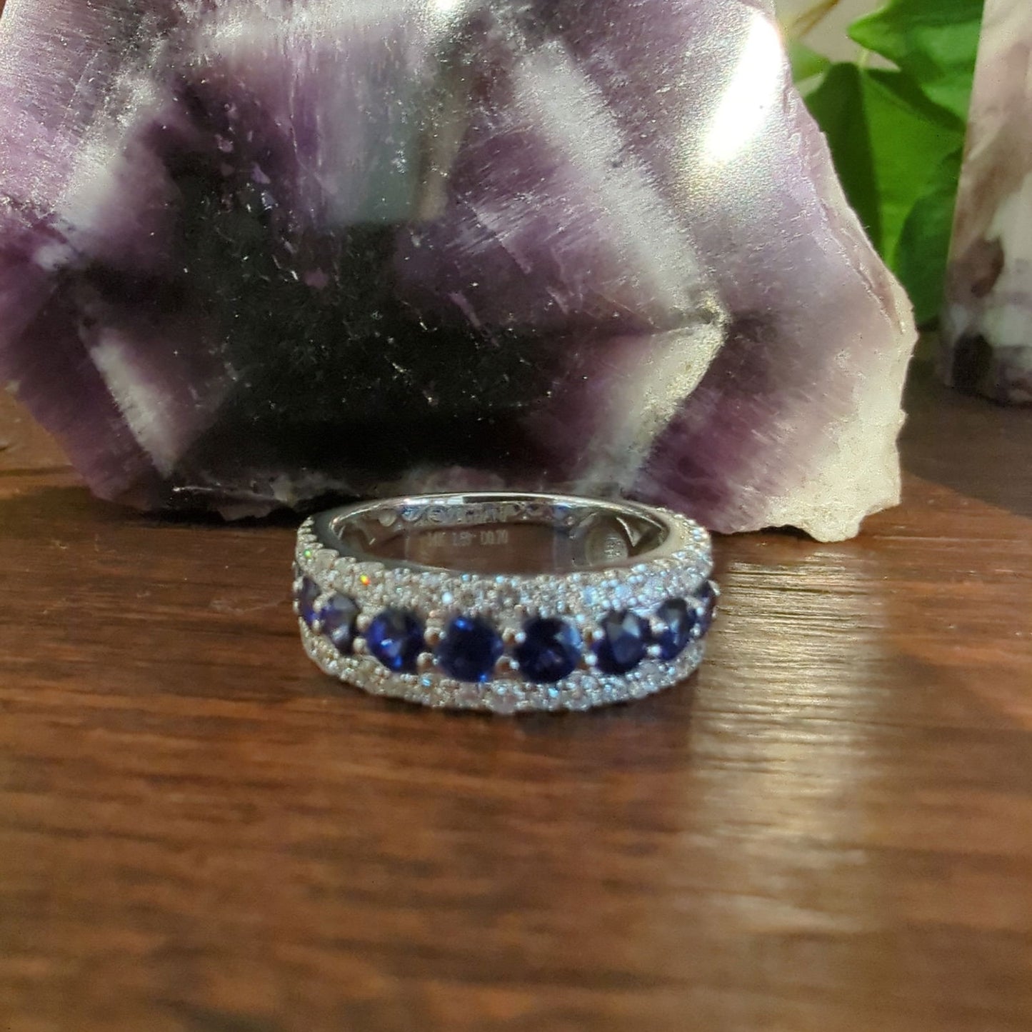 Photo of Zeghani Blue Sapphire and Diamond Ring in a decorative scene, designed by , available at Plumb Gold & Plumb Silver