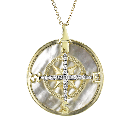 Photo of Zeghani Mother of Pearl and Diamond Compass Necklace in a decorative scene, designed by , available at Plumb Gold & Plumb Silver