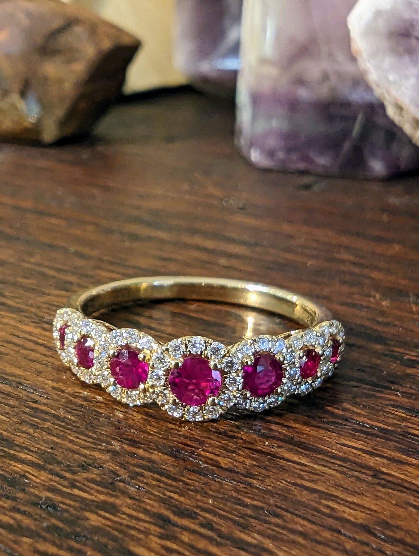 Photo of Zeghani Seven Halo Gemstone Ring in a decorative scene, designed by , available at Plumb Gold & Plumb Silver