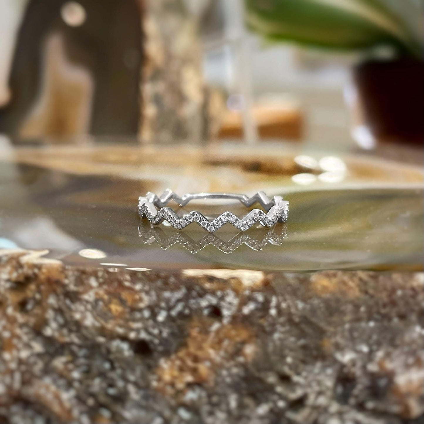 Photo of "Zig-Zag" Band in a decorative scene, designed by , available at Plumb Gold & Plumb Silver