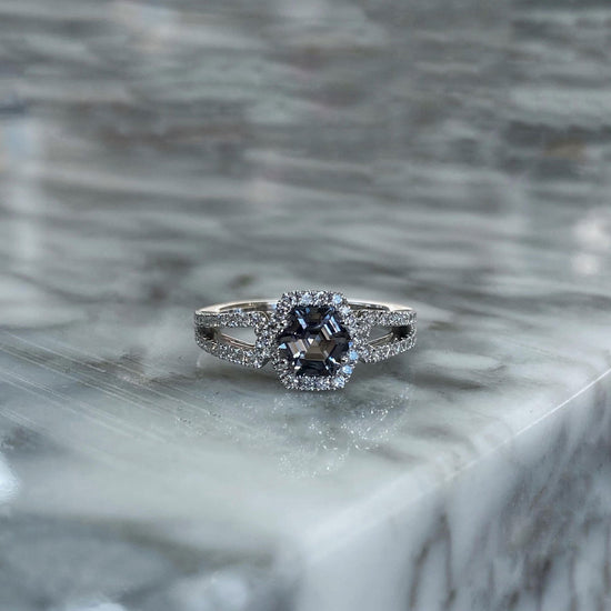 Photo of Zoma Color Grey Hexagon Ring in a decorative scene, designed by , available at Plumb Gold & Plumb Silver