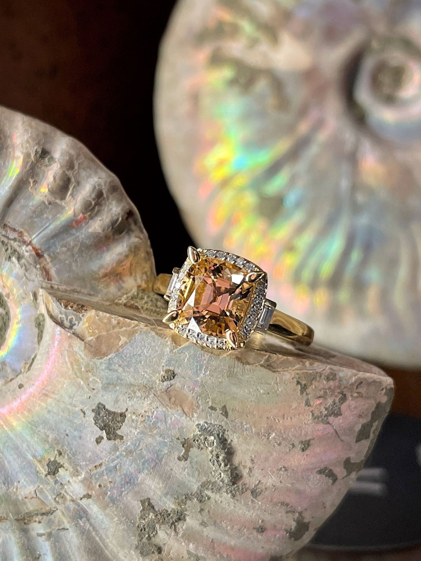 Photo of Zoma Color Peach Tourmaline Ring in a decorative scene, designed by , available at Plumb Gold & Plumb Silver